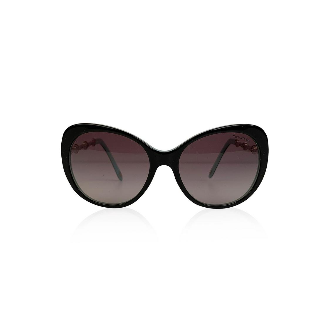 Tiffany & Co. Black TF 4053 B Sunglasses 56/17 135 mm: Tiffany & Co. Butterfly Sunglasses mod. TF 4053-B. Black acetate frame with turquoise interior. Silver metal arms with beautiful crystal flowers. Gradient gray lenses. 100% UV protection. Frame Made i