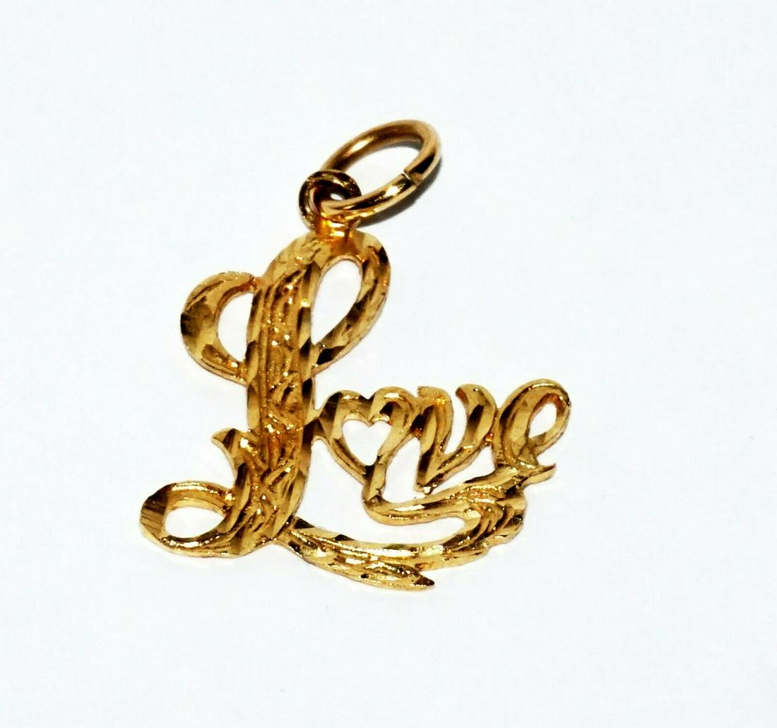 Vintage 14k Yellow Gold Love Motif Pierce Pendant Charm: Up for sale from a local client in Honolulu Hawaii this Vintage 14k yellow gold Love motif pierced pendant charm. The condition is described above for more information please check the photos. Measure