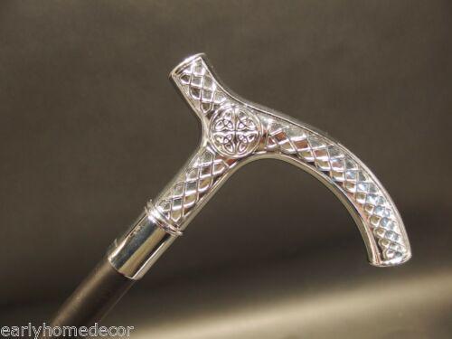 Silver & Black Celtic Metal Slim Walking Stick Cane: 36" Long,.. Handle is 5 1/2" Long 7/8" circumference Wonderful reproduction walking cane, cast from an original. The handle is all heavy solid metal with a hollow metal shaft. Nice quality! Reserve: $