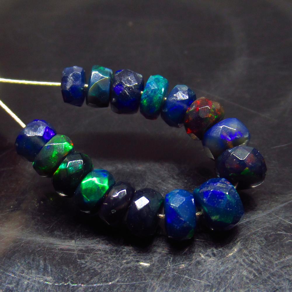 4.38 Ct Natural 16 Drilled Faceted Black Fire Opal: No Reserve! Title: 4.38 Ct Natural 16 Drilled Faceted Black Fire Opal Beads Stone clarity:Translucent Gemstones: Natural Black Opal Beads Carat weights: 4.38 Size/Dimensions: 4.50 to 4.80 mm / 16 PC's