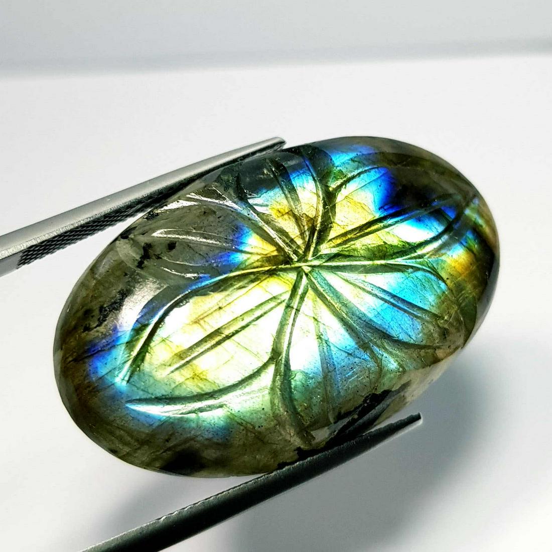 53.64 Ct Natural Labradorite Flower Face Oval Cabochon: No Reserve! Title: 53.64 Ct Natural Labradorite Flower Face Oval Cabochon Color clarity:Opaque Gemstones: Loosegemstone Carat weights: 53.64 Size/Dimensions: 35.28 x 21.15 x 8.65 Additional Info:Oval
