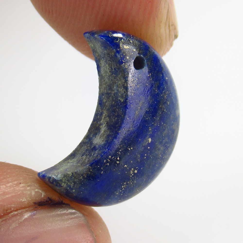 7.30 Ctw Natural Blue Lapis Lazuli Half Moon Cab: No Reserve! Title: 7.30 Ctw Natural Blue Lapis Lazuli Half Moon Cab Stone clarity:Opaque Gemstones: Lapis Lazuli Carat weights: 15.70 x 7.50 x 7.50 mm Size/Dimensions: 7.3 Additional Info:Drilled Half