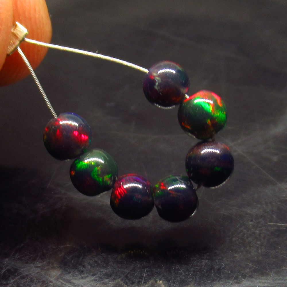2.00 Ctw Natural 7 Drilled Black Opal Ball Beads: No Reserve! Title: 2.00 Ctw Natural 7 Drilled Black Opal Ball Beads Stone clarity:Opaque Gemstones: Black Opal Beads Carat weights: 4.00 to 4.30 mm / 7 PC's Size/Dimensions: 2 Additional Info:Drilled 