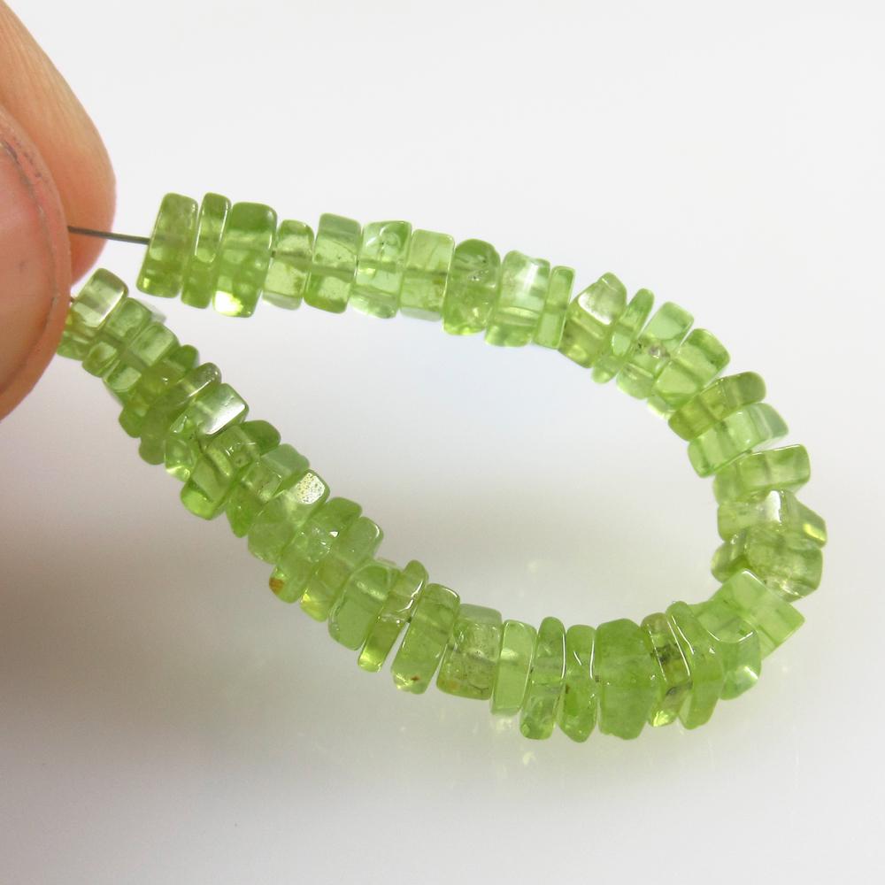 14.27 Ct Natural 44 Drilled Pakistan Peridot Square: No Reserve! Title: 14.27 Ct Natural 44 Drilled Pakistan Peridot Square Beads Stone Clarity: VVS Gemstone: Natural Peridot Beads Carat Weight: 14.27 Size/Dimensions: 4.0x4.0 - 4.5x4.5 mm / 44 PC's Addi
