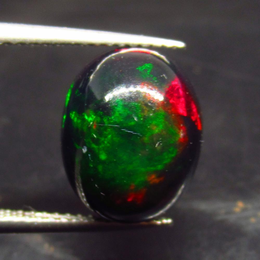 4.81 Ct Natural Ethiopian Black Fire Opal Oval Cab: No Reserve! Title: 4.81 Ct Natural Ethiopian Black Fire Opal Oval Cab Stone Clarity: Translucent Gemstone: Natural Black Opal Carat Weight: 4.81 Size/Dimensions: 12.30 x 10.10 x 7.50 mm Additional Inf