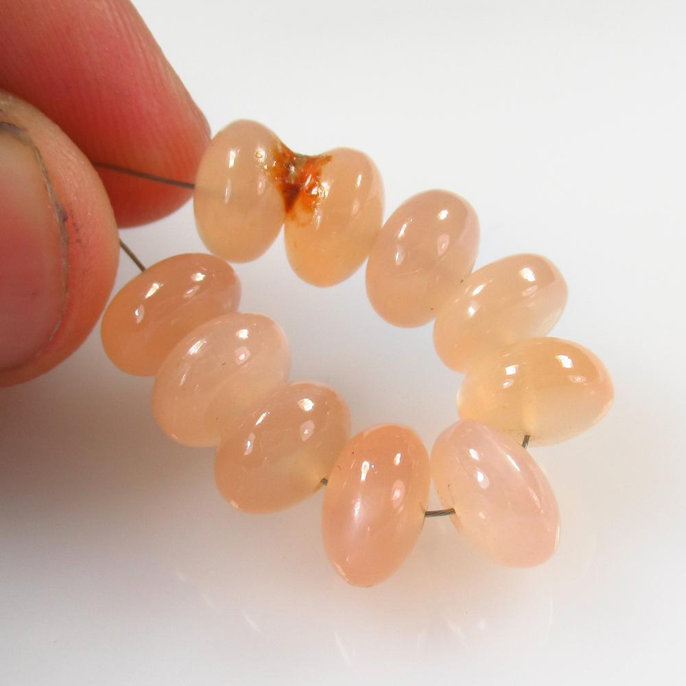 28.41 Ct Natural 10 Drilled Moonstone Round Beads: No Reserve! Title: 28.41 Ct Natural 10 Drilled Moonstone Round Beads Stone Clarity: Semi-Transparent Gemstone: Natural Moonstone Beads Carat Weight: 28.41 Size/Dimensions: 8.50 to 8.80 mm / 10 PC's Ad