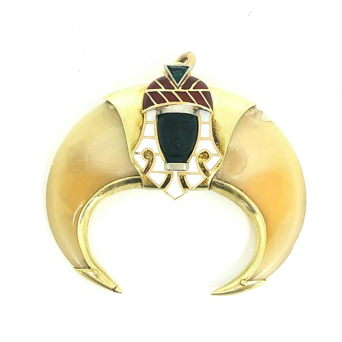 C 1890: KG J000 C 1890's Maison Blackamoor Pendant Material: 18K Yellow Gold, Enamel, Carved Black Onyx, Bakelite Gemstone: Emerald Measurements: 2Â” x 1.5Â” Weight: 20.5 g A MUST HAVE FOR COLLECTOR! <