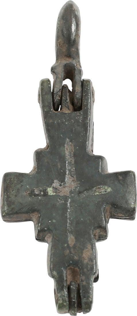 FINE BYZANTINE RELIQUARY CROSS: Bronze. 9th-11th century. just over 1 2/8” height. The beams with slightly flared terminals. The cross beam centered and the junction with a square. An incised line cross to each side with a sma