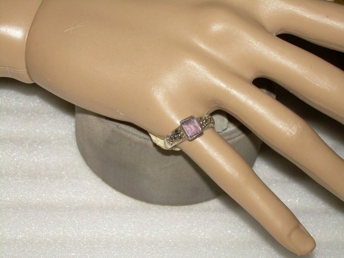 Vintage Sterling Amethyst Marcasite Ring - Size 5.75: Vintage sterling silver ring comes with an amethyst stone. The stone is bezel set and is accented with marcasite on both sides. It is a size 5.75 and is marked 925 inside the band. The ring was bought