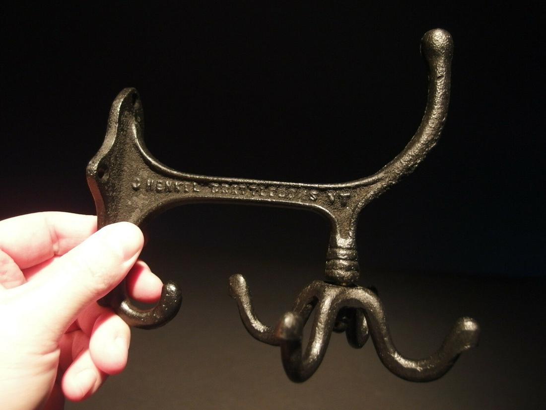 BLACK Cast Iron Hook Rotating Bracket Spinning Coat: (1) Hook 6" Tall.. 4 1/4" Wide 6" Extension 1 Charming and functional sturdy iron wall hook cast from an antique. Notice the 4 fully rotating bottom hooks. All Heavy cast iron.... Cast hook reads: Hen