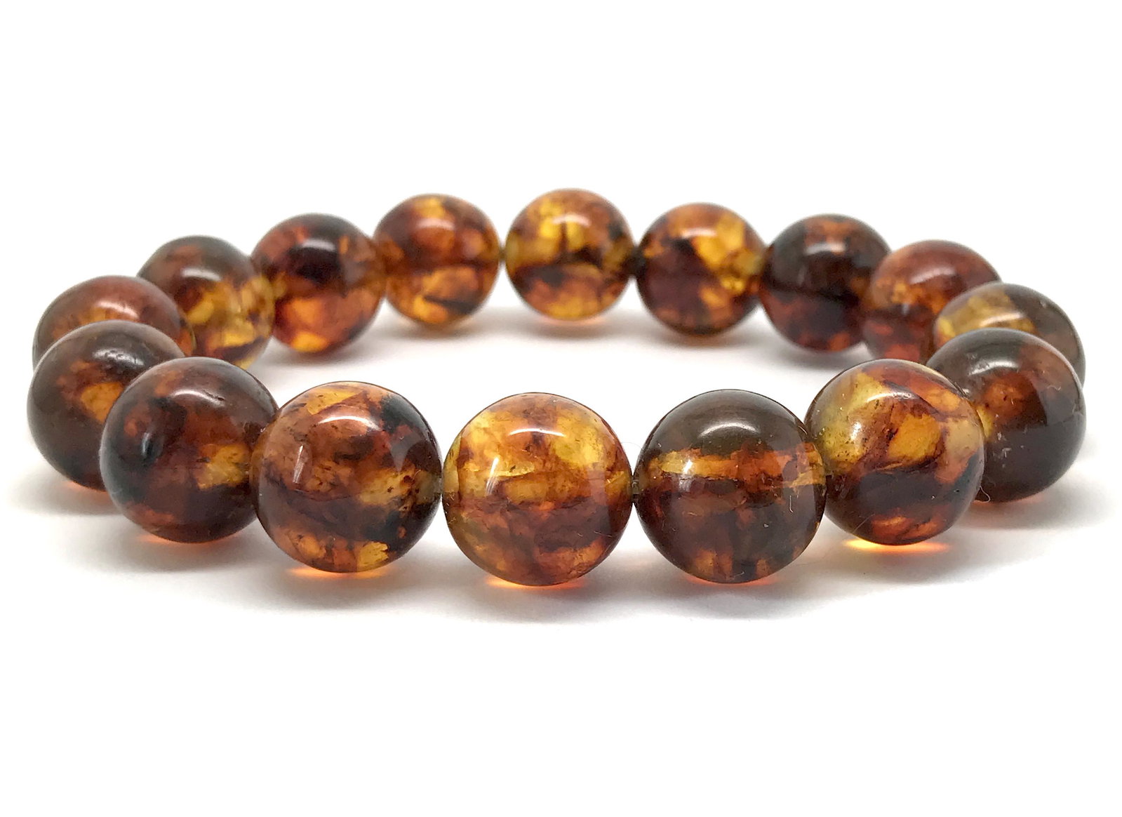Marvellous Amber Bracelet made from Round Amber beads: Title: Marvellous Amber Bracelet made from Round Amber beads Metal: None Gemstones: Amber Weight: 20.0 g Size: Bead size: 13.1 mm Made of: Reconstituted Amber Additional Information: Amber does not co