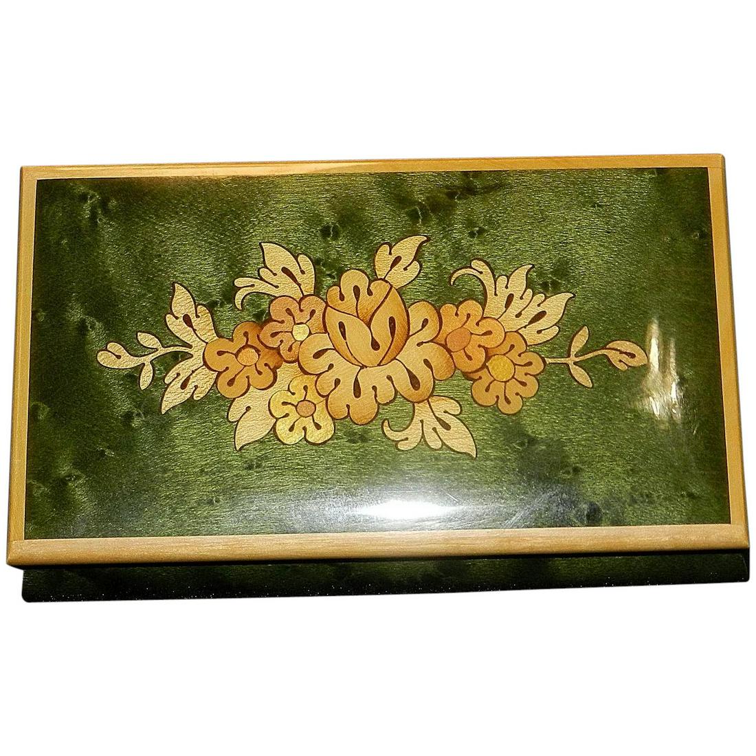 Vintage Sorrento Italian Inlaid Ring Music Box with: This beautiful Vintage Sorrento Italian Inlaid Ring Music Box with Reuge works Playing Fur Elise is in near MINT condition. It measures 5 ½” x 3 ¼” x 2 ¼”. Has an 18 note tine that plays Fur