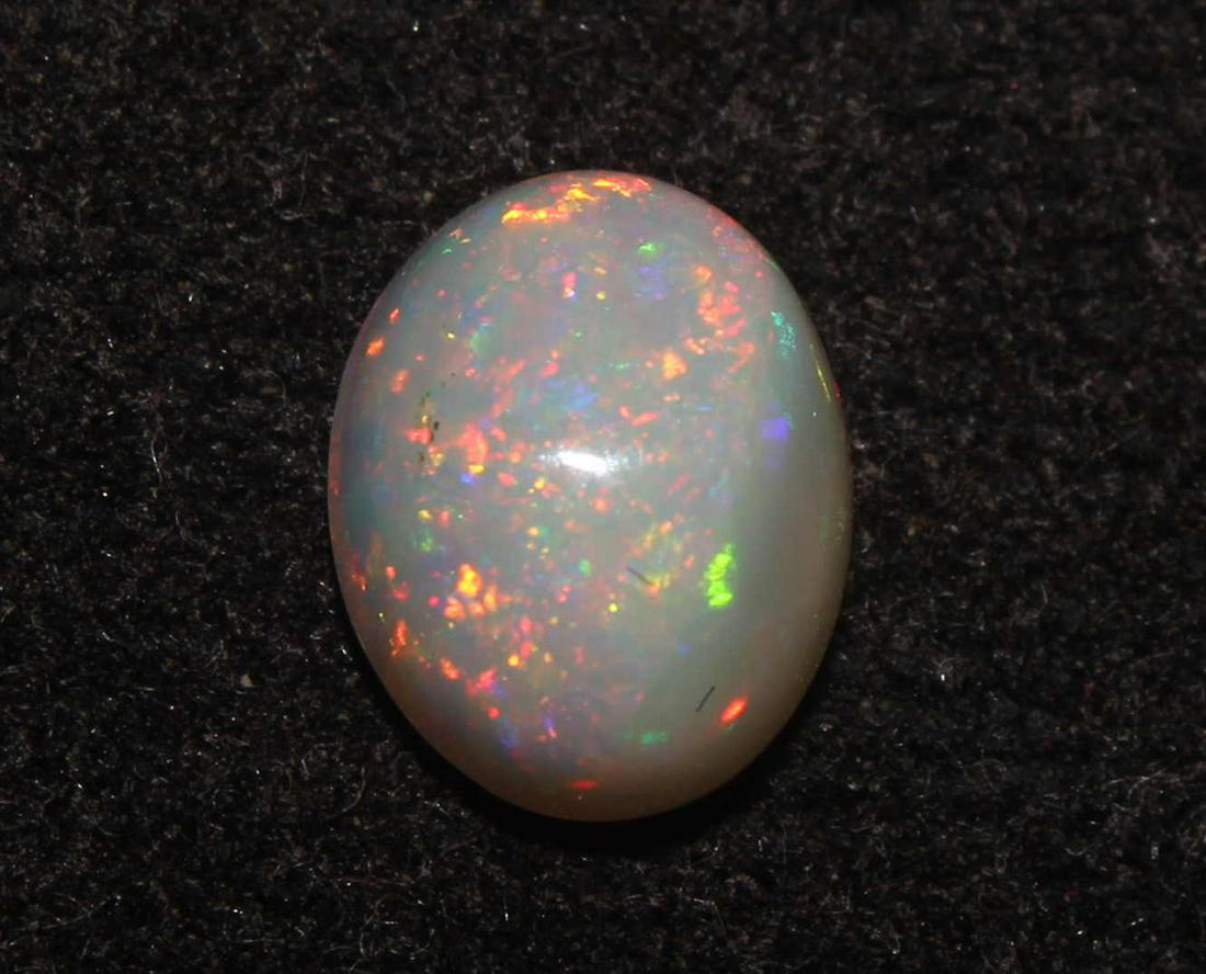 1.41 Cts Natural Ethiopia Opal: No Reserve! Title: 1.41 Cts Natural Ethiopia Opal Description: Gemstone: Natural Ethiopia Opal Weight: 1.41 Carats Measurements: 8.7x7x4.2 mm Shape : Oval Cabochon Transparency: translucent Colour : W