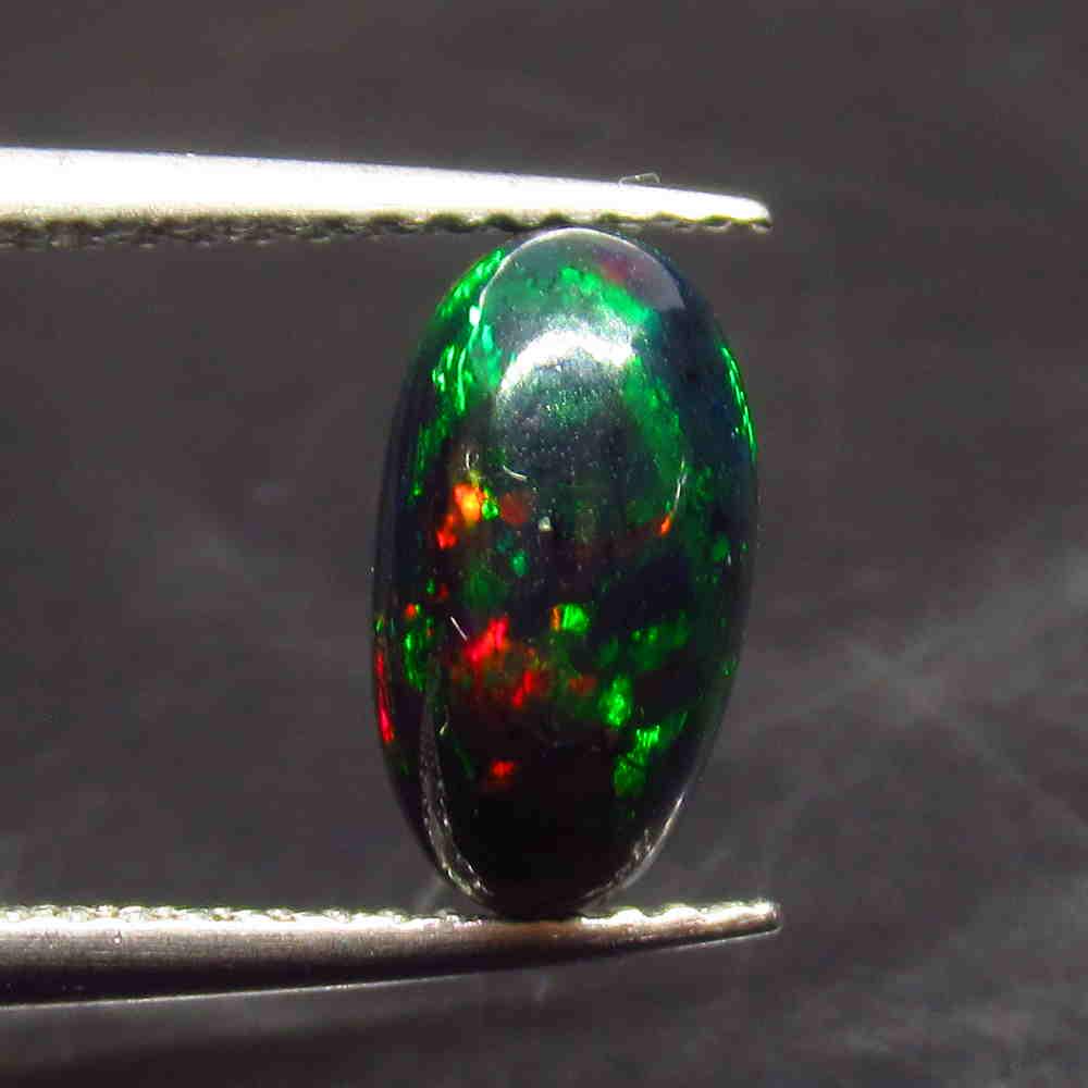 1.16 Ctw Natural Ethiopian Black Fire Opal Oval Cab: No Reserve! Title: 1.16 Ctw Natural Ethiopian Black Fire Opal Oval Cab Stone Clarity: Opaque Gemstones: Black Opal Size/Dimensions: 1.16 Carat Weights: 10.40 x 5.80 x 4.40 mm Additional Information: E
