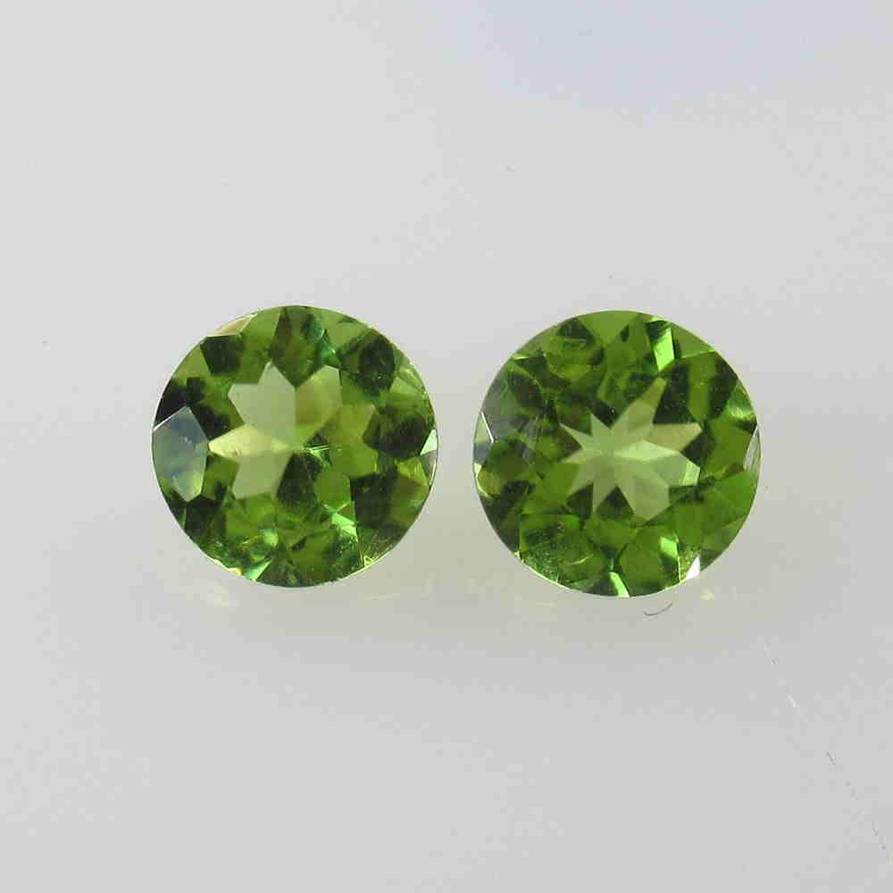 2.41 Ctw Natural Peridot Round Pair: No Reserve! Title: 2.41 Ctw Natural Peridot Round Pair Stone Clarity: VVS Gemstones: Peridot Size/Dimensions: 2.41 Carat Weights: 7.00 x 7.00 x 4.00 mm / 2 PC's Additional Information: Top Class Luste
