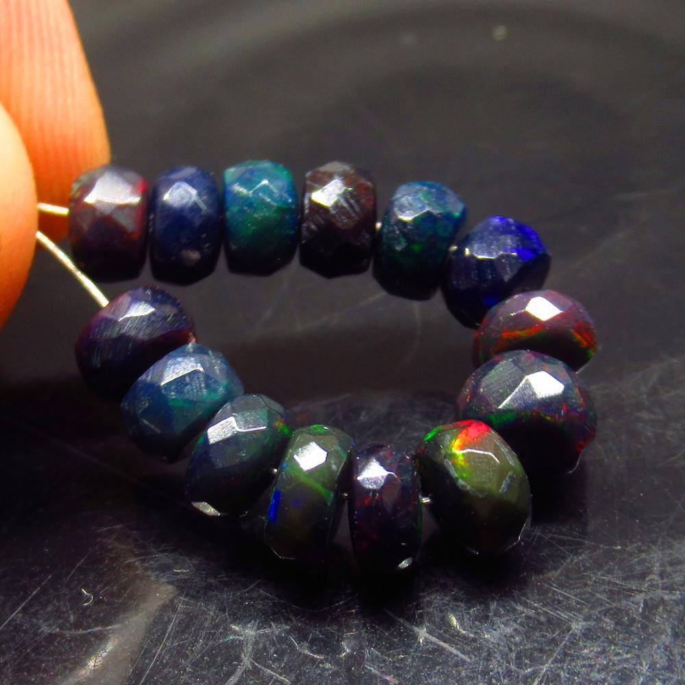 8.30 Ct Natural 14 Drilled Faceted Black Fire Opal: No Reserve! Title: 8.30 Ct Natural 14 Drilled Faceted Black Fire Opal Beads Stone Clarity: Translucent Gemstones: Natural Black Opal Beads Carat Weights: 8.3 Size/Dimensions: 3.70 to 6.40 mm / 24 PC's