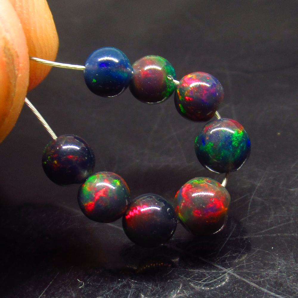2.75 Ct Natural 8 Drilled Black Fire Opal Beads (1 of 2)
