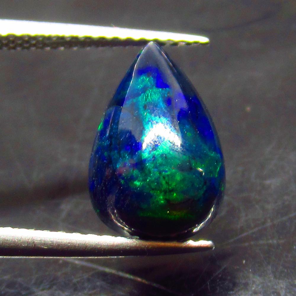 2.61 Ct Natural Ethiopian Black Fire Opal Pear Cab: No Reserve! Title: 2.61 Ct Natural Ethiopian Black Fire Opal Pear Cab Stone Clarity: Translucent Gemstones: Natural Black Opal Carat Weights: 2.61 Size/Dimensions: 12.90 x 8.30 x 6.10 mm Additional In