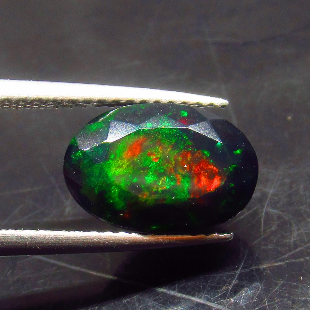 2.48 Ct Natural Ethiopian Black Fire Opal Oval Cut: No Reserve! Title: 2.48 Ct Natural Ethiopian Black Fire Opal Oval Cut Stone Clarity: Translucent Gemstones: Natural Black Opal Carat Weights: 2.48 Size/Dimensions: 11.70 x 7.70 x 6.00 mm Additional In