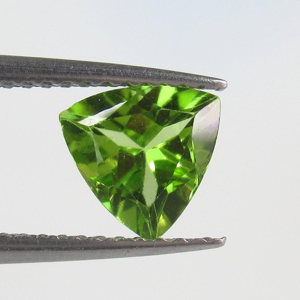 1.08 Ct Natural Peridot Trillion Cut: No Reserve! Title: 1.08 Ct Natural Peridot Trillion Cut Stone Clarity: VVS Gemstones: Natural Peridot Carat Weights: 1.08 Size/Dimensions: 7.00 x 7.00 x 3.90 mm Additional Information: Top Class Luste