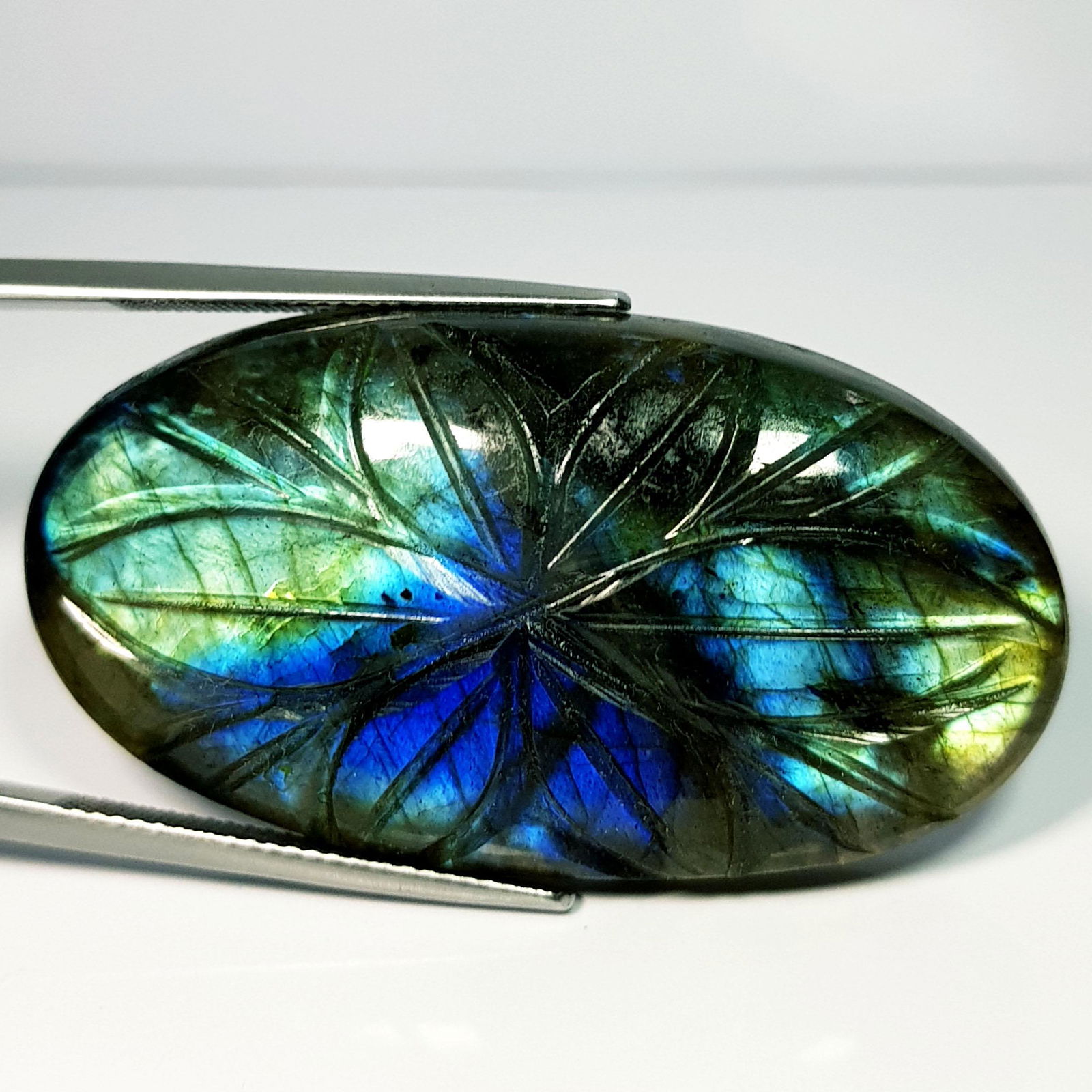 74.26 ct Natural Labradorite Oval Flower Cabochon: No Reserve! Title: 74.26 ct Natural Labradorite Oval Flower Cabochon Color/Clarity: IF / VVS Carat Weight: 47.26 Dimensions: 43.70 x 23.80 x 8.00 Additional Information: Oval / USA Shipping: Domestic