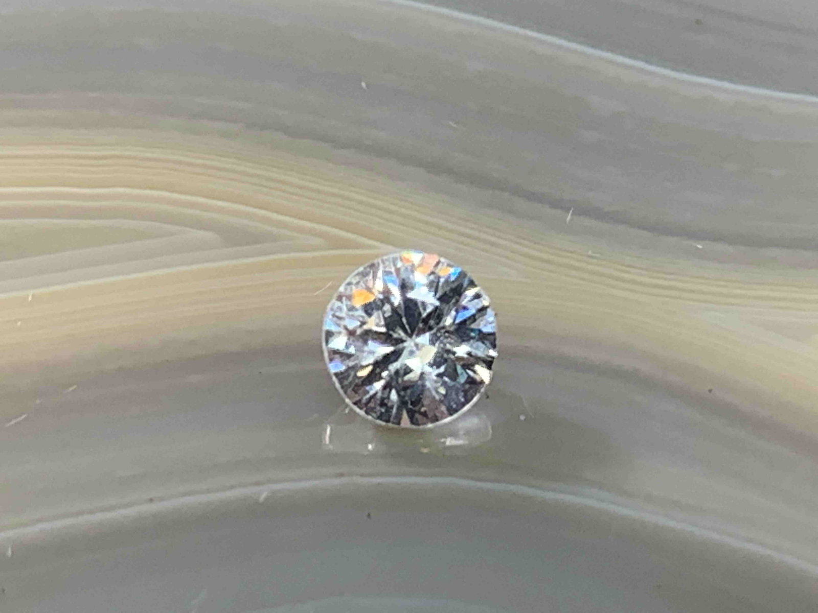 Zircon Round .79 Carats Loose Gemstone: No Reserve! Title: Zircon Round .79 Carats Loose Gemstone Additional Information: Zircon Round .79 Carats Loose Gemstone Materials: Natural Stone Dimensions: 4mm Shipping: Domestic: Flat-rate of $7.00