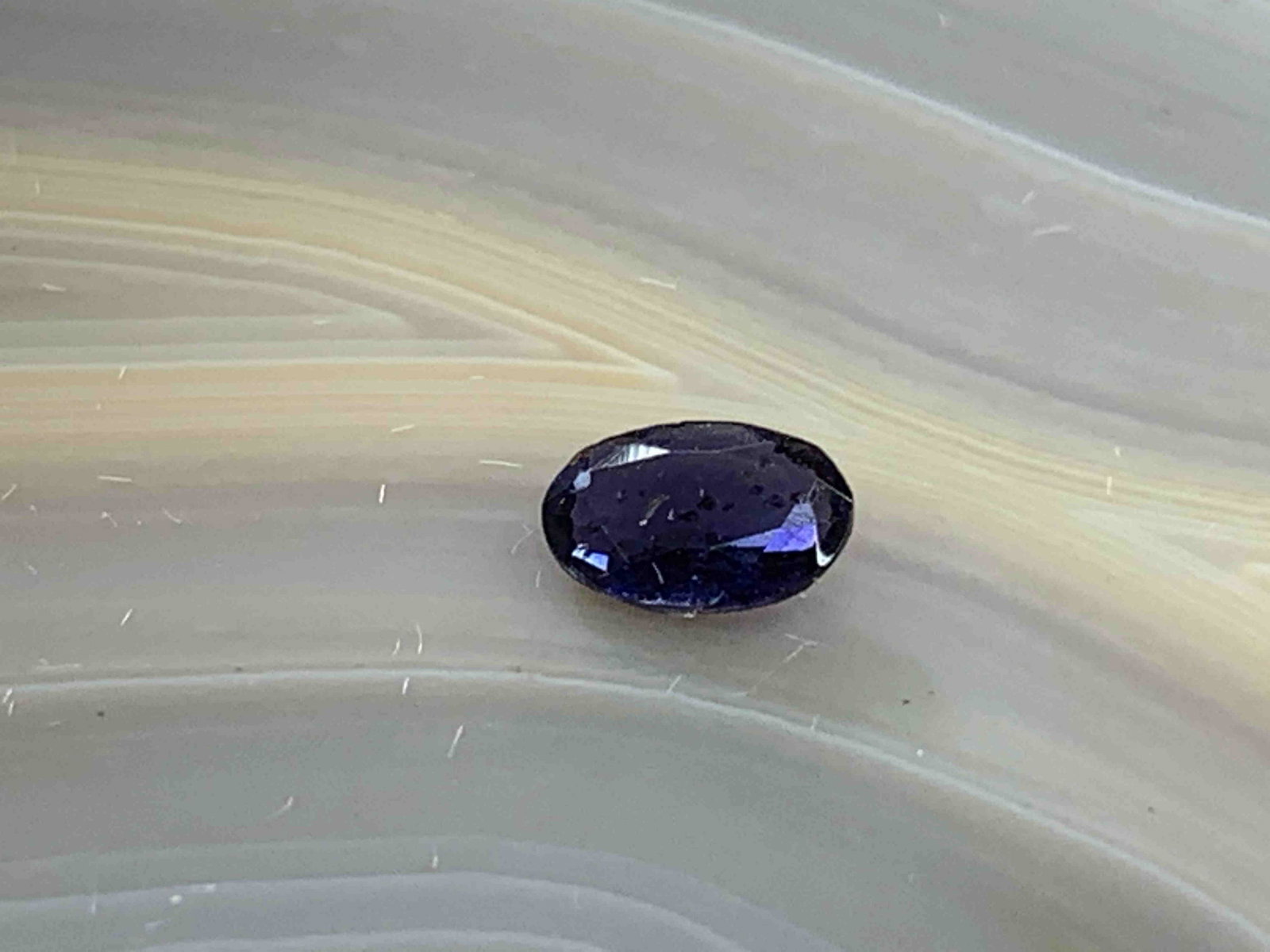 Iolite Oval .33 Carats Loose Gemstone: No Reserve! Title: Iolite Oval .33 Carats Loose Gemstone Additional Information: Iolite Oval .33 Carats Loose Gemstone Materials: Natural Stone Dimensions: 5mmx3mm Shipping: Domestic: Flat-rate of $7.