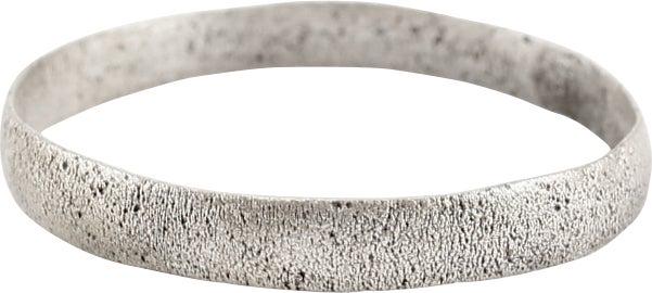 ANCIENT VIKING WEDDING RING, SIZE 11 1/4: Late 9th-early 11th century AD. Silvered bronze, size 11 1/4. Narrowband, 3.1mm. Textured from burial and professionally refurbished with the pure silver overlay restored. Gift boxed with a certificat