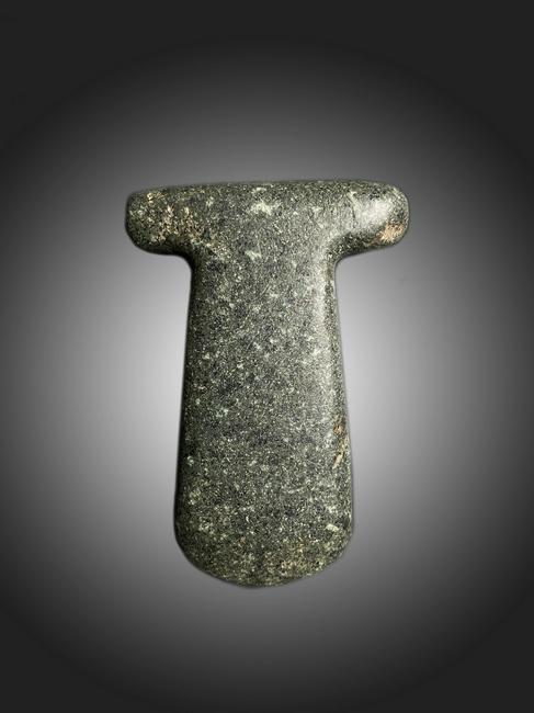 T-shaped precolumbian celt: Title: T-shaped precolumbian celt Date/Period: Dimensions: Size: 2.5" W x 4" H Material: Stone Description: Very rare T-shaped celt. Greenstone axe heads, commonly known as “celts,” were some of t