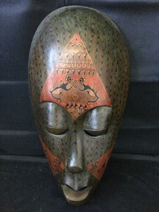 Painted wooden mask, from Lombok Island - Indonesian: Title: Painted wooden mask, from LombokIsland - Indonesian Date/Period: 20th C Materials: Wood and pigments Dimensions: 50 cm. Provenance/Additional Info:Tattoo tribal mask Reserve: $120.00 Shipping: 