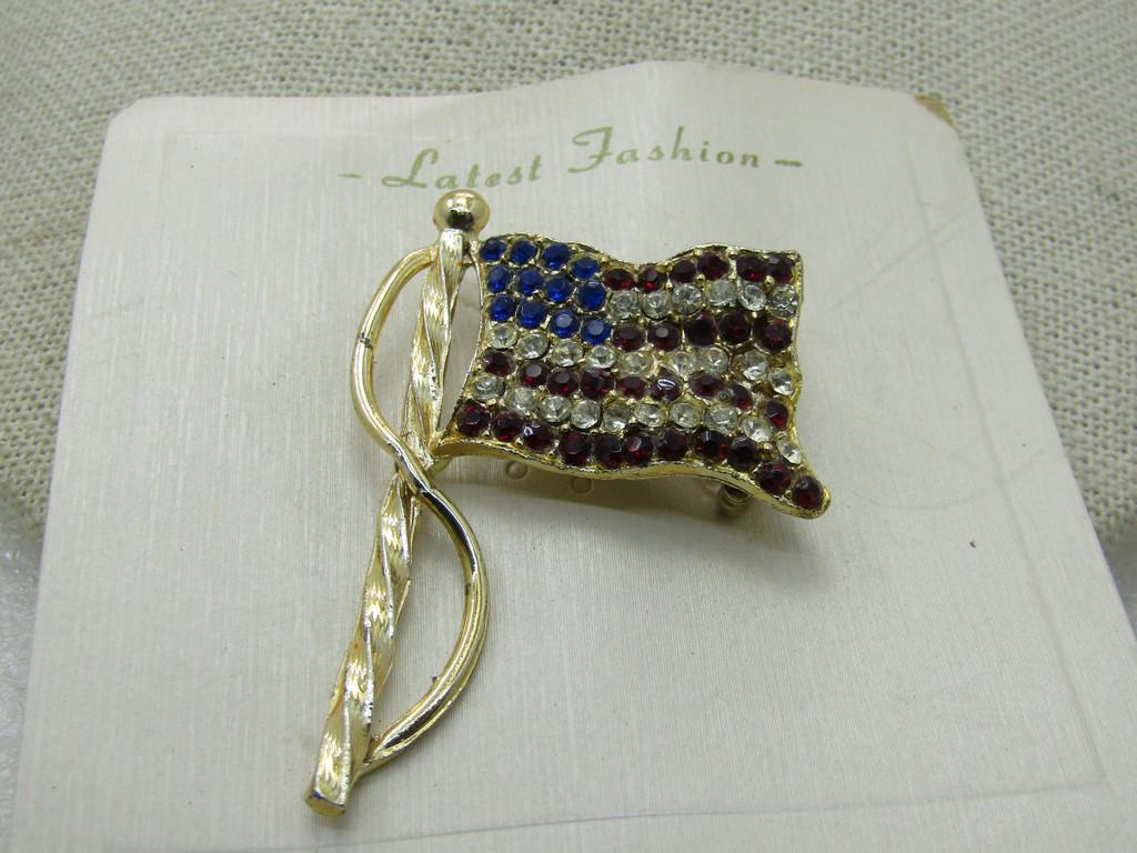Vintage Blue & Clear Rhinestone USA Flag, Gold Tone, 2": Vintage Blue & Clear Rhinestone USA Flag, Gold Tone, 2" by 1.5", Vintage new on card marked Latest Fashion, sold at Nichols, long defunct store. Very good condition. (INV. W.82920.6 SS2685 J LD 10/8/2