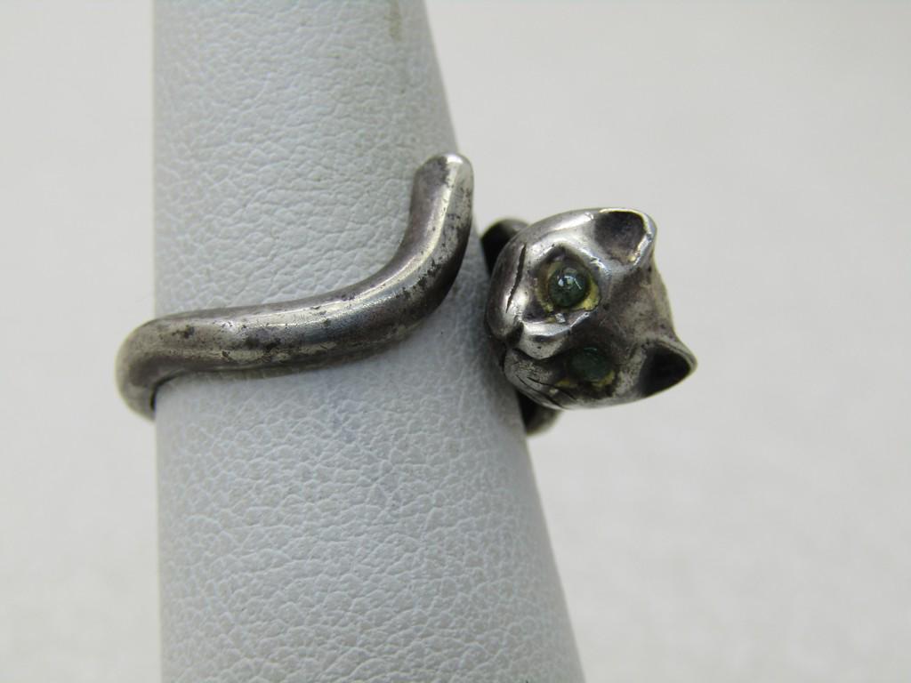Vintage Sterling Silver Cat Ring, Wrapped, Sz. 6: Vintage Sterling Silver Cat Ring, Wrapped, Sz. 6, blue rhinestone eyes. The cat is wearing a collar and the band behind the head also has the shoulders in the design as it wraps around the finger. It