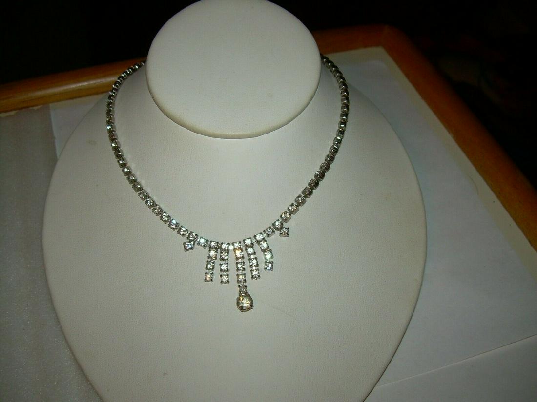 Vintage Art Deco rhinestone Drop Necklace/Choke; r, 15": Vintage art deco rhinestone drop choker/necklace - 15" with a 1" drop. A mix of 3 mm across and drop. There is a center round stone approximately 6.5 mm. The clasp is a hook and ball bead. Great for p