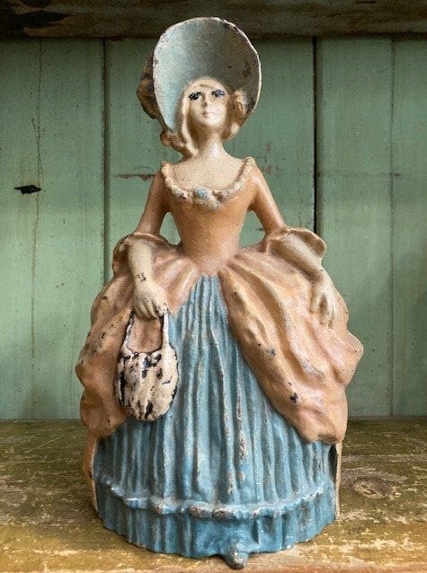 Antique LVL Lady in Bonnett Doorstop Cast Iron: Title: Antique LVL Lady in Bonnett Doorstop Cast Iron Date/period: APPROX EARLY 1900'S Dimensions: APPROX 10.25 X 3 DEEP X 5.5 WIDE Material: METAL Description: Marked LVL patent pending LVL Candlesti