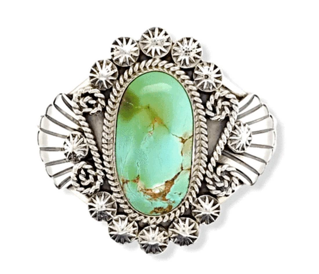 Navajo Royston Turquoise Embellished Silver Bracelet: Round silver embellishments form a delightful frame for this gorgeous piece of Royston turquoise. Handcrafted by master Navajo silversmith Mary Ann Spencer. Measurements: Top/Front Design: 2" tall, 3"
