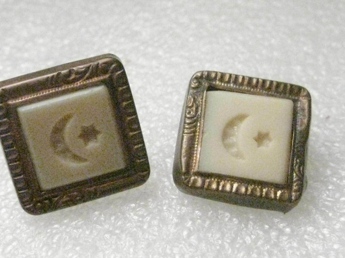 Truly Vintage Art Deco Masonic Cuff Links, signed Trade: Vintage - truly vintage - Art Deco designed 3/4" square, stamped brass with stamped ivory-colored glass, plastic, celluloid? insert with a start and moon. They have the old style clip on the back - no