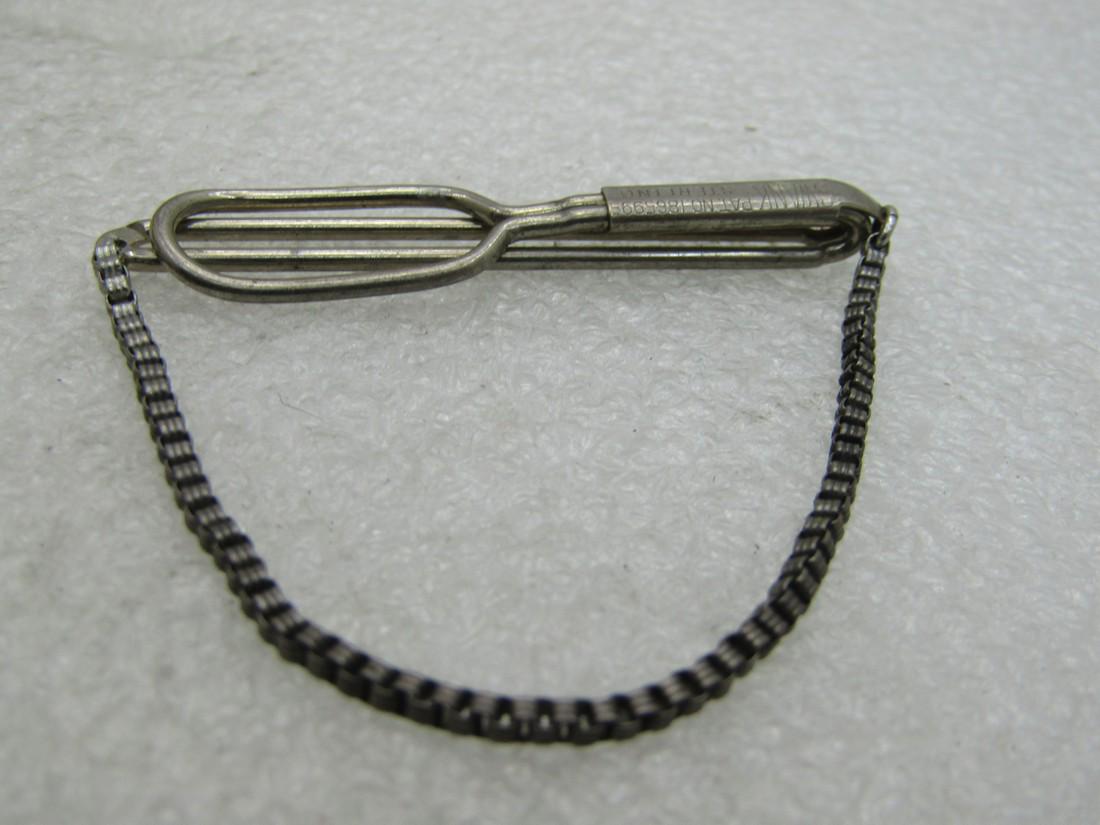 Vintage Swank Sterling Silver Tie Bar with Chain,: Vintage Swank Sterling Silver Tie Bar with Chain, 194's, marked sterling and pat. No. 1865995. It is appx 6.45 grams and 2" wide. Signed Swank. Good to very good condition other than oxidation that ca
