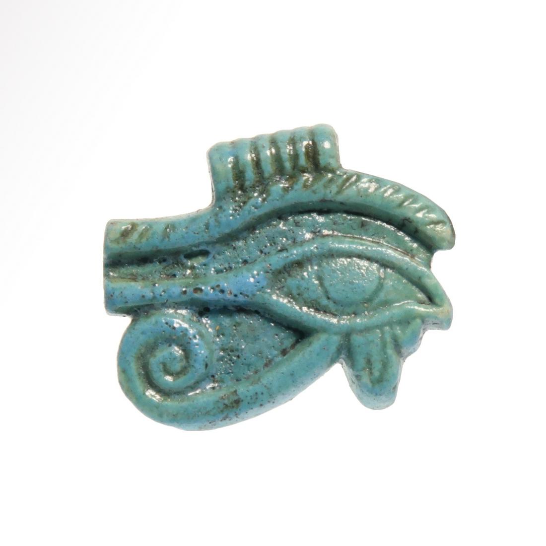 Egyptian Turquoise-Blue Faience Eye Amulet, 600 B.C.: Title: Egyptian Turquoise-Blue Faience Eye Amulet, 600 B.C. Date/Period: Egypt, c. 350 B.C. Dimension: 2.3cm. L. - 0.95 inches Material: Faience Provenance: Provenance: Collection Dr. M. Dickey, Plymo