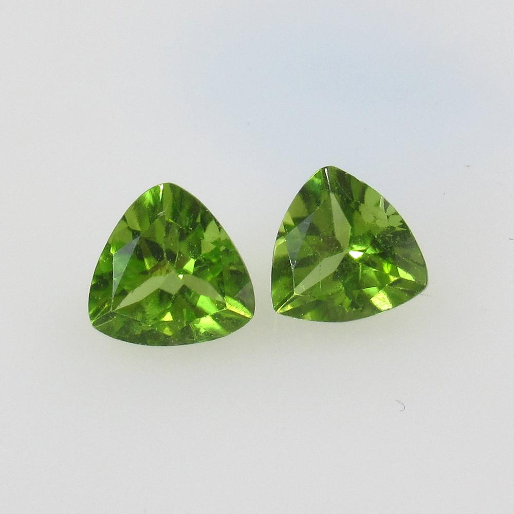 2.66 Ct Natural Pakistan Peridot Trillion Pair: No Reserve! Title: 2.66 Ct Natural Pakistan Peridot Trillion Pair Stone Clarity: VVS Gemstone: Natural Peridot Carat Weight: 2.66 Size/Dimensions: 7.00 x 7.00 x 4.40 mm / 2 PC's Additional Information