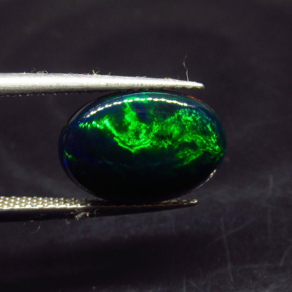 1.94 Ct Natural Ethiopian Black Fire Opal Oval Cab: No Reserve! Title: 1.94 Ct Natural Ethiopian Black Fire Opal Oval Cab Stone Clarity: Translucent Gemstone: Natural Black Opal Carat Weight: 1.94 Size/Dimensions: 13.40 x 9.20 x 3.30 mm Additional Info
