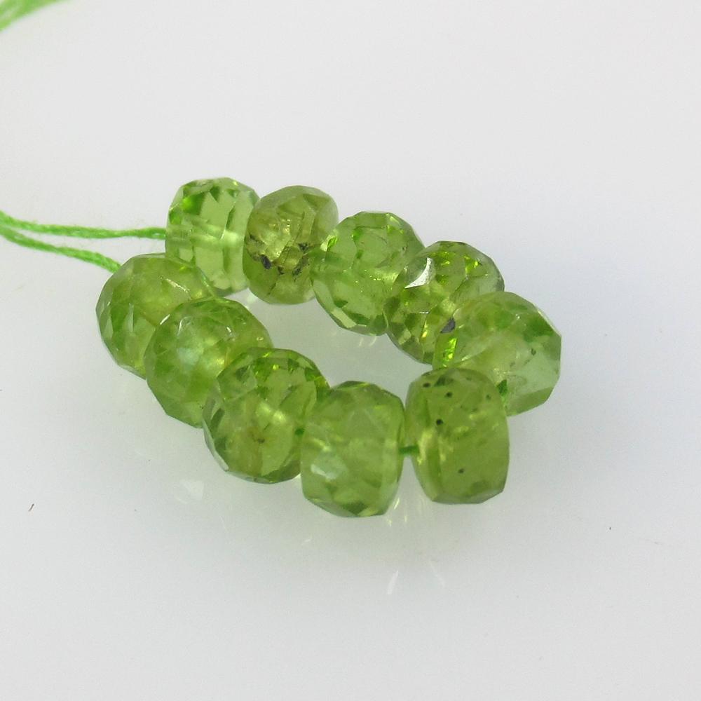7.30 Ct Natural 10 Drilled Round Peridot Round Beads: No Reserve! Title: 7.30 Ct Natural 10 Drilled Round Peridot Round Beads Stone Clarity: Transparent Gemstone: Natural Peridot Beads Carat Weight: 7.3 Size/Dimensions: 4.70 to 5.00 mm / 10 PC's Addition