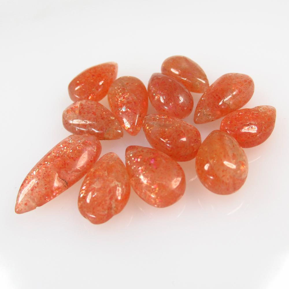 35.17 Ct Natural 12 Drilled Orange Sunstone Pear Beads: No Reserve! Title: 35.17 Ct Natural 12 Drilled Orange Sunstone Pear Beads Stone Clarity: Opaque Gemstone: Natural Sunstone Beads Carat Weight: 35.17 Size/Dimensions: 12.0x7.5 to 16.5x7.5 mm / 12 PC's