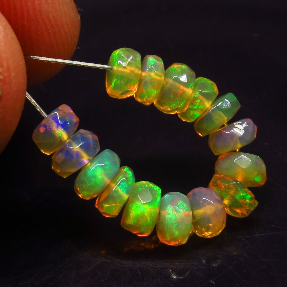 4.08 Ct Natural 15 Ethiopian Drilled Faceted Fire Opal: No Reserve! Title: 4.08 Ct Natural 15 Ethiopian Drilled Faceted Fire Opal Beads Stone Clarity: Transparent Gemstone: Natural Faceted Fire Opal Beads Carat Weight: 4.08 Size/Dimensions: 4.50 to 4.70 mm
