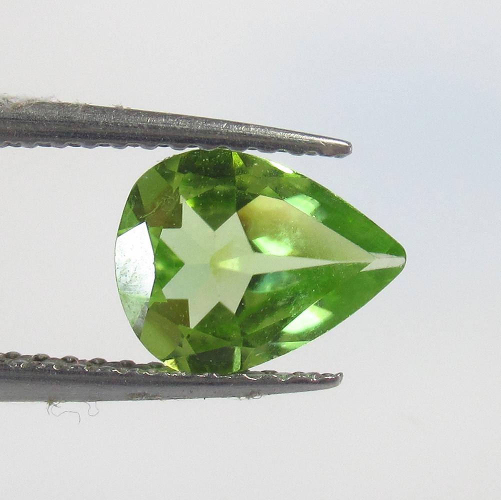 1.06 Ct Natural Peridot Pear Cut: No Reserve! Title: 1.06 Ct Natural Peridot Pear Cut Stone Clarity: VVS Gemstone: Natural Peridot Carat Weight: 1.06 Size/Dimensions: 8.60 x 6.70 x 3.30 mm Additional Information: Top Class Luster / Ex