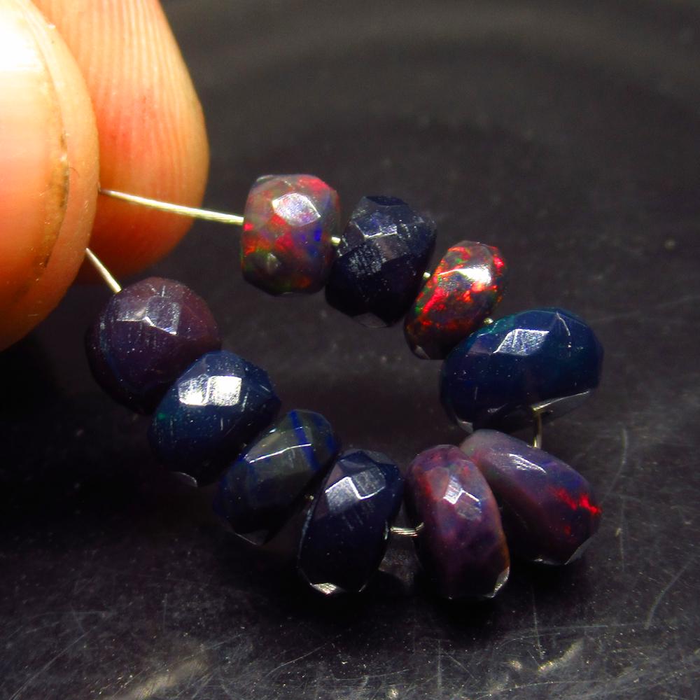 6.88 Ct Natural 10 Drilled Faceted Black Fire Opal: No Reserve! Title: 6.88 Ct Natural 10 Drilled Faceted Black Fire Opal Beads Stone Clarity: Translucent Gemstone: Natural Black Opal Beads Carat Weight: 6.88 Size/Dimensions: 6.00 to 7.10 mm / 10 PC's 