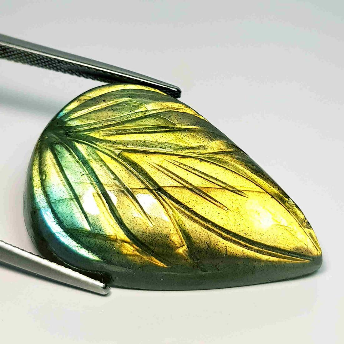 43.06 ct Natural Labradorite Pear Flower Cabochon: No Reserve! Title:43.06 ct Natural Labradorite Pear Flower Cabochon Color/Clarity: IF / VVS Carat Weight: 43.06 Size/Dimensions: 32.10 x 21.30 x 8.65 Additional Information: Pear / USA Shipping: Dome