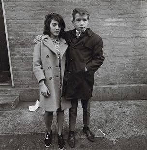 DIANE ARBUS - Teenage Couple, Hudson St. NYC, 1963: Artist: Diane Arbus Title: Teenage Couple on Hudson Street, NYC, 1963 Medium: Photo Litho, 1972, USA Dimensions: 8.3x8.45" Description: Heat Wax Mounted on 11x14" Conservation Board Artist Bio: Diane