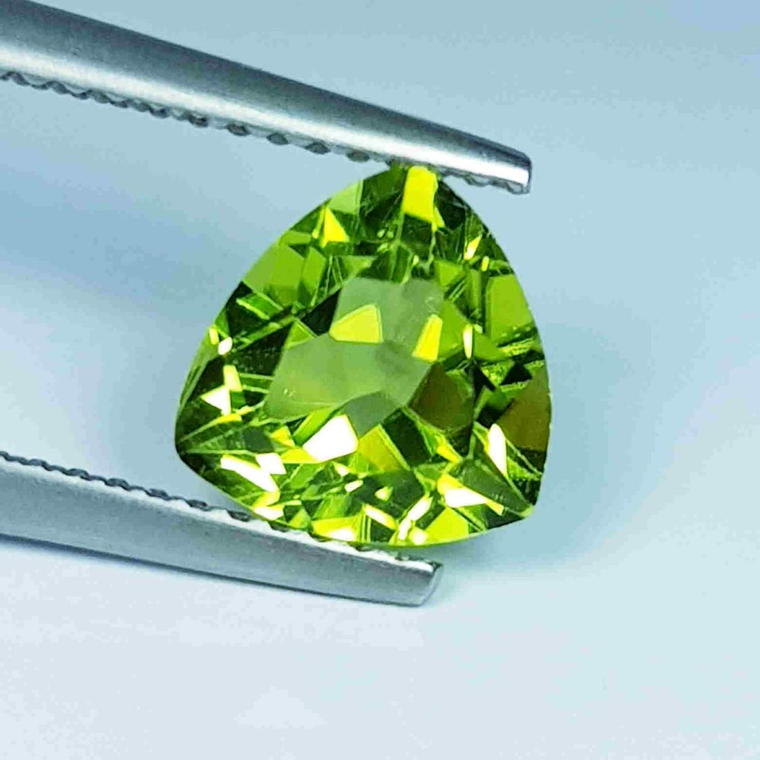 1.90 Ct Natural Peridot Trillion Cut: No Reserve! Title: 1.90 Ct Natural Peridot Trillion Cut Color/Clarity: IF - VVS Gemstones: Loosegemstone Carat Weights: 1.9 Size/Dimensions: 7.90 x 7.80 x 4.70 Additional Information: Trillion / Pakis