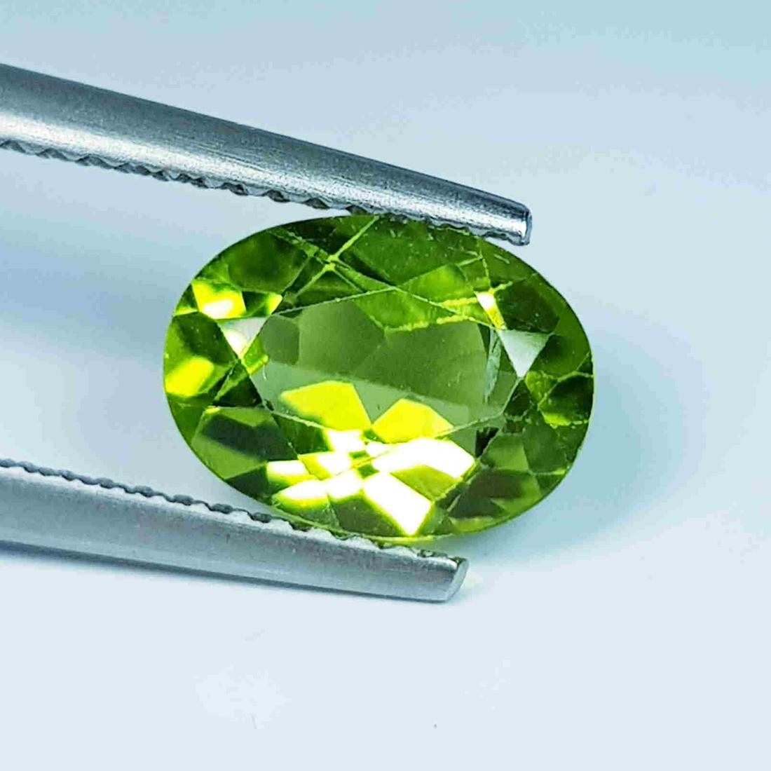 1.89 Ct Natural Peridot Oval Cut: No Reserve! Title: 1.89 Ct Natural Peridot Oval Cut Color/Clarity: IF - VVS Gemstones: Loosegemstone Carat Weights: 1.89 Size/Dimensions: 9.00 x 6.70 x 4.20 Additional Information: Oval / Pakistan Shi