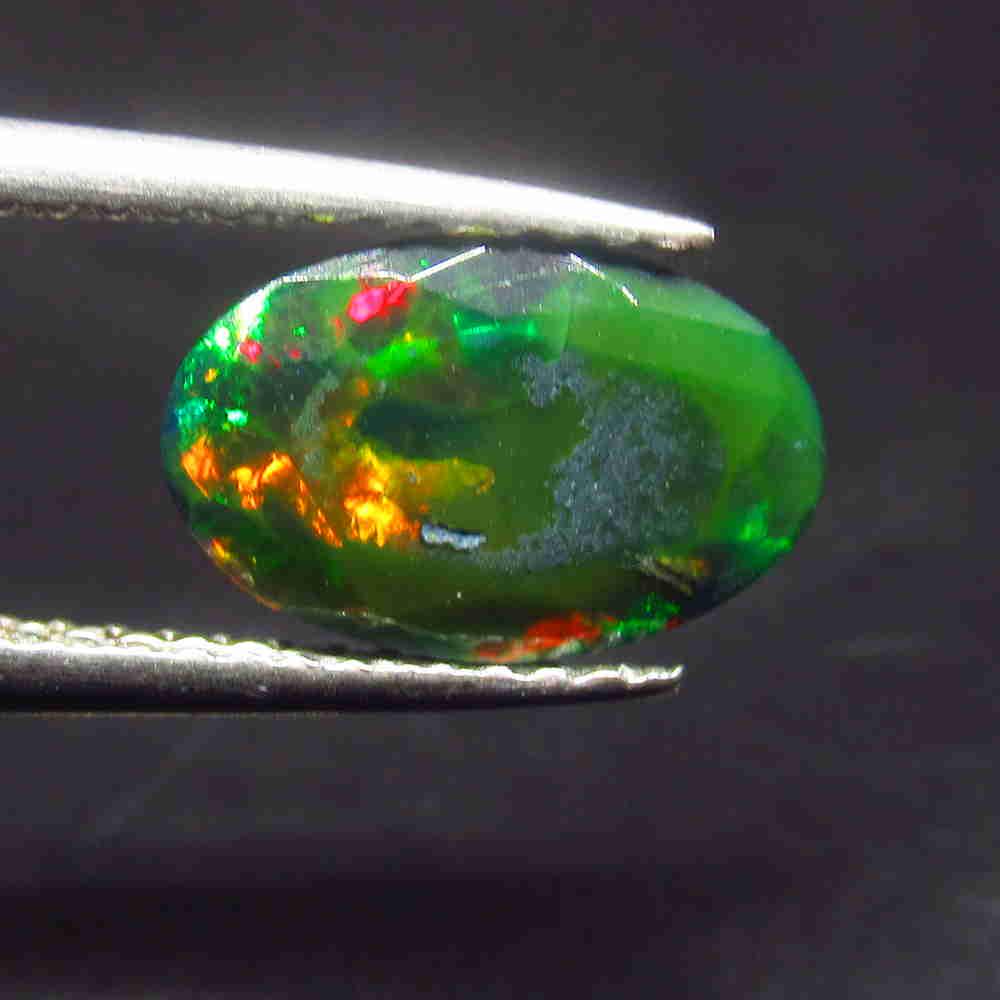 1.25 Ctw Natural Ethiopian Black Fire Opal Oval Cut: No Reserve! Title: 1.25 Ctw Natural Ethiopian Black Fire Opal Oval Cut Stone Clarity: Translucent Gemstone: Black Opal Carat Weight: 1.25 Size/Dimensions: 10.50 x 6.80 x 3.80 mm Additional Information